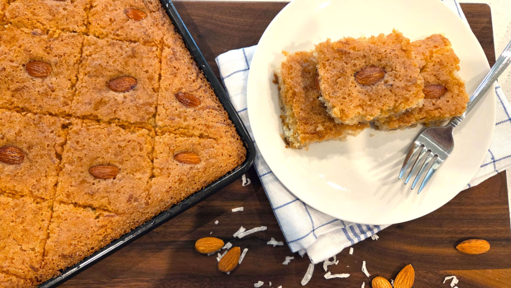Easy vegan basbousa recipe baked until golden brown and decorated with whole almonds.