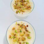 Egyptian mahalabia recipe served in a glass dessert bowl topped with pistachios