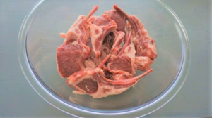 Raw lamb chops in a bowl for the Mediterranean grilled lamb chops recipe