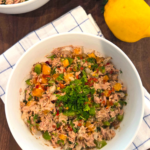 No Mayo Mediterranean Tuna Salad Recipe made with tuna, bell peppers, parsley, olive oil, and lemon juice in a serving bowl.