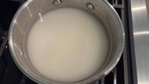 sugar and water in a saucepan for vegan basbousa syrup