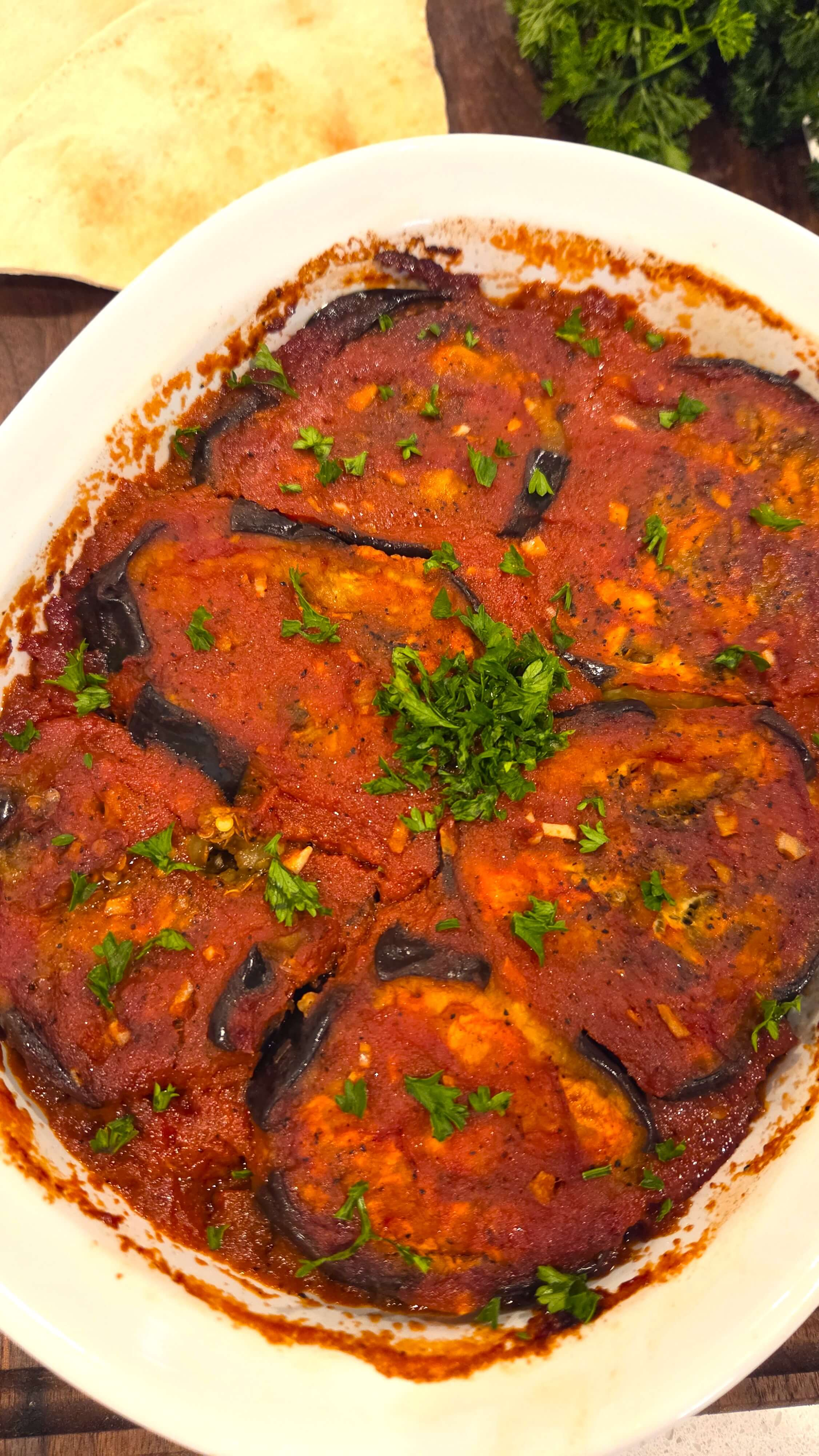 Egyptian moussaka with roasted eggplant, green bell peppers, ground beef, and tangy tomato sauce.