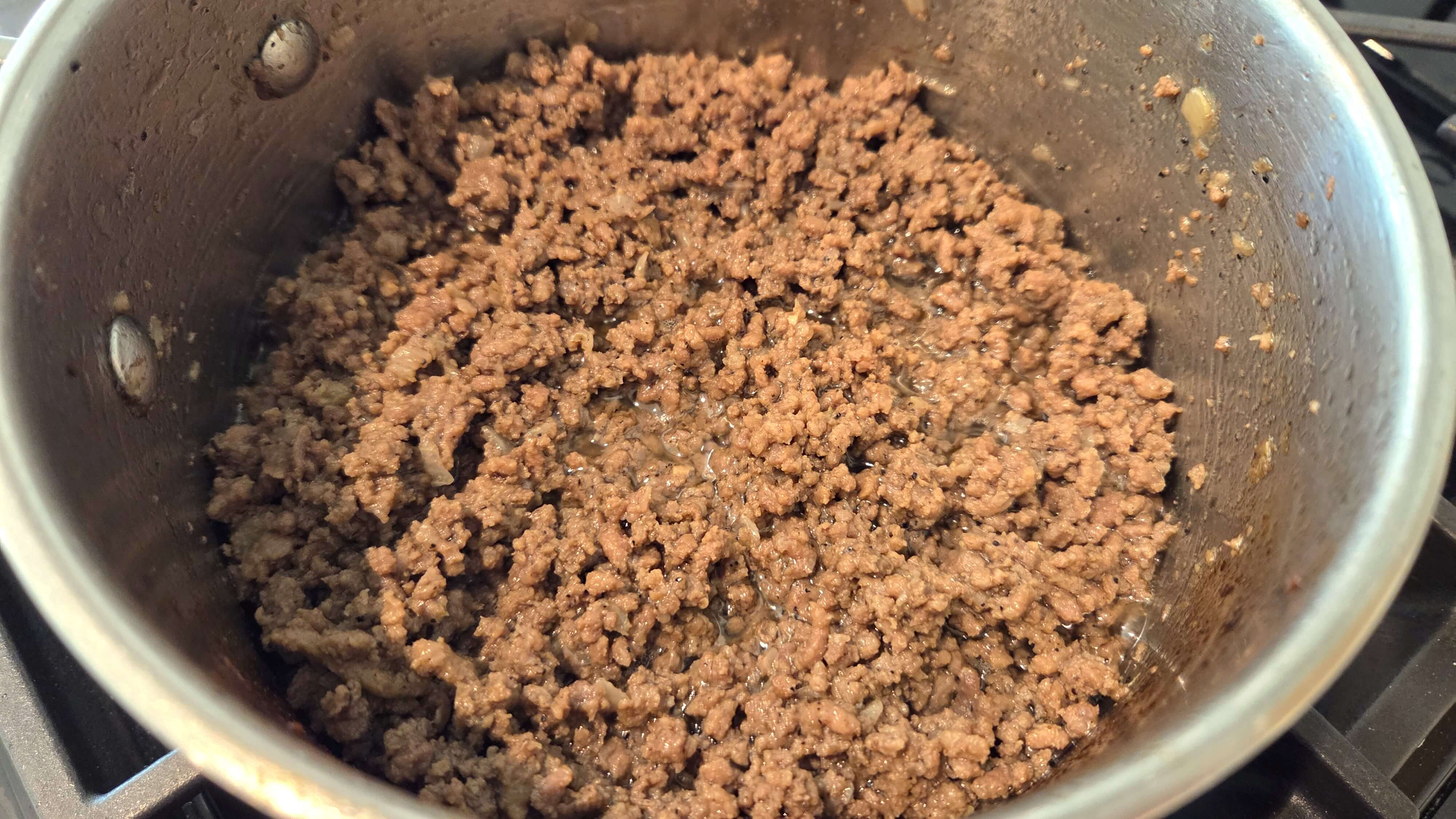 Ground beef and diced onions browned with black pepper, nutmeg, and cardamom.