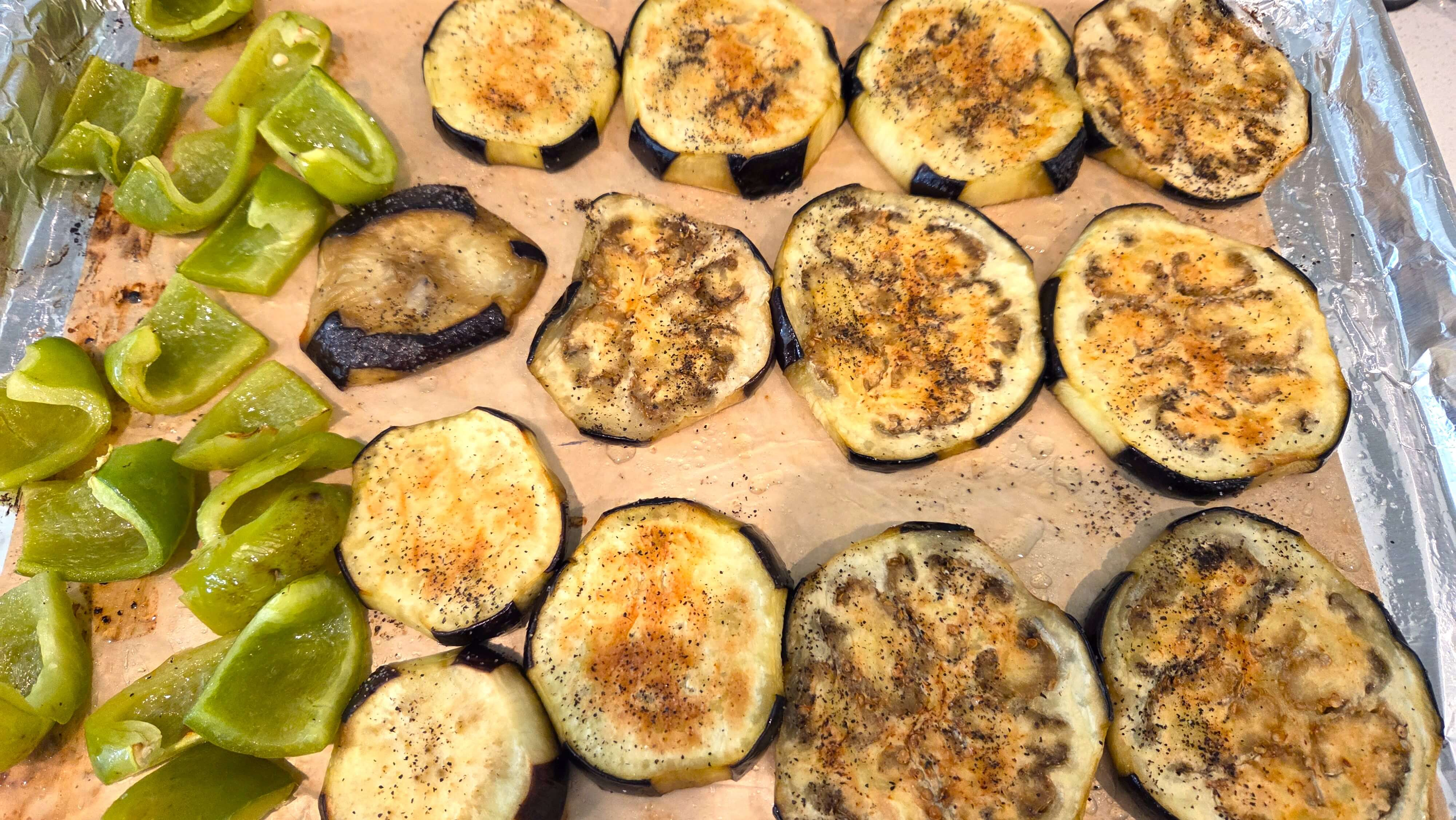 Eggplant slices and green bell pepper roasted until tender and lightly golden.