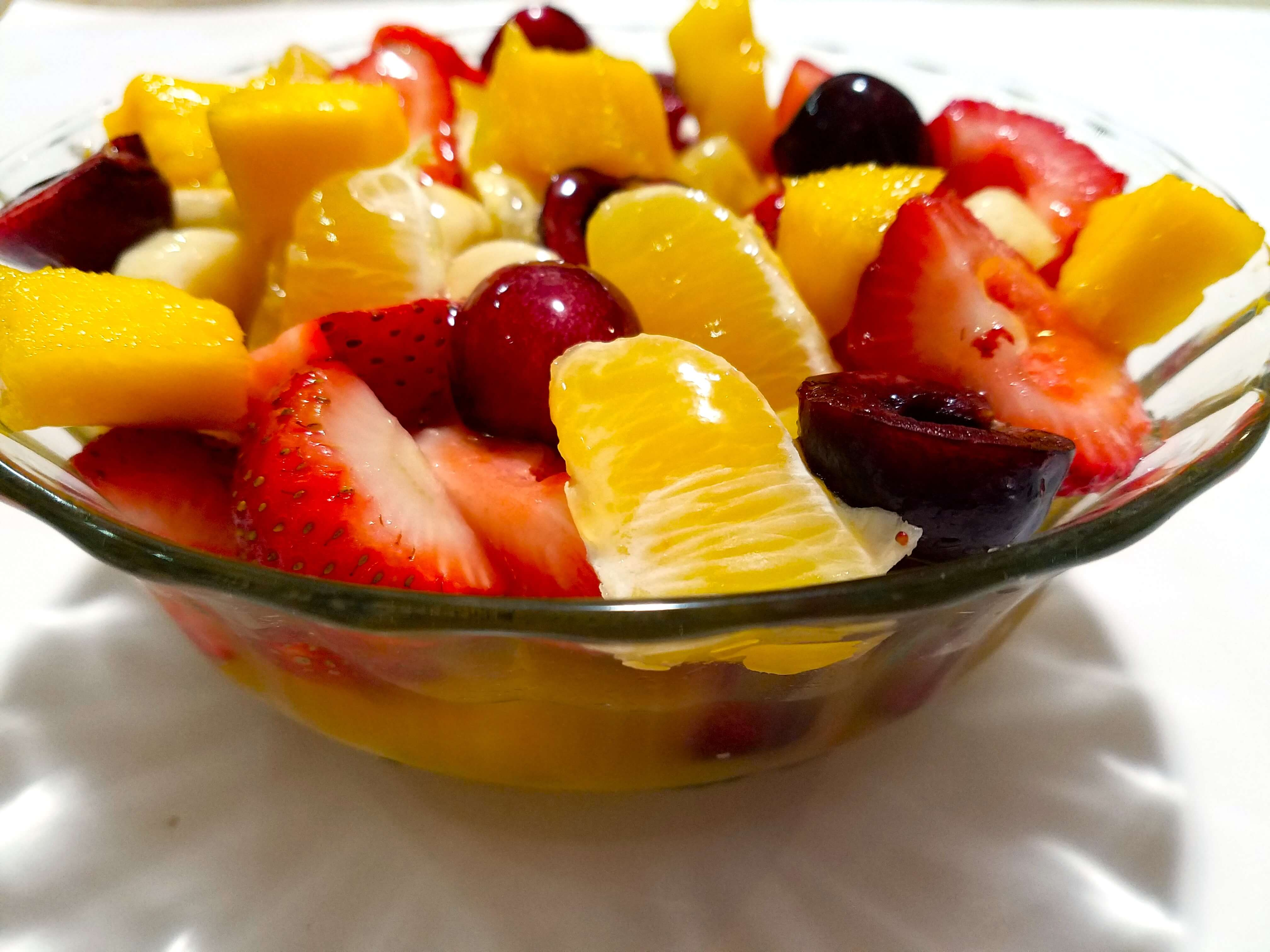 Chilled Egyptian fruit salad with mango juice ready to serve.