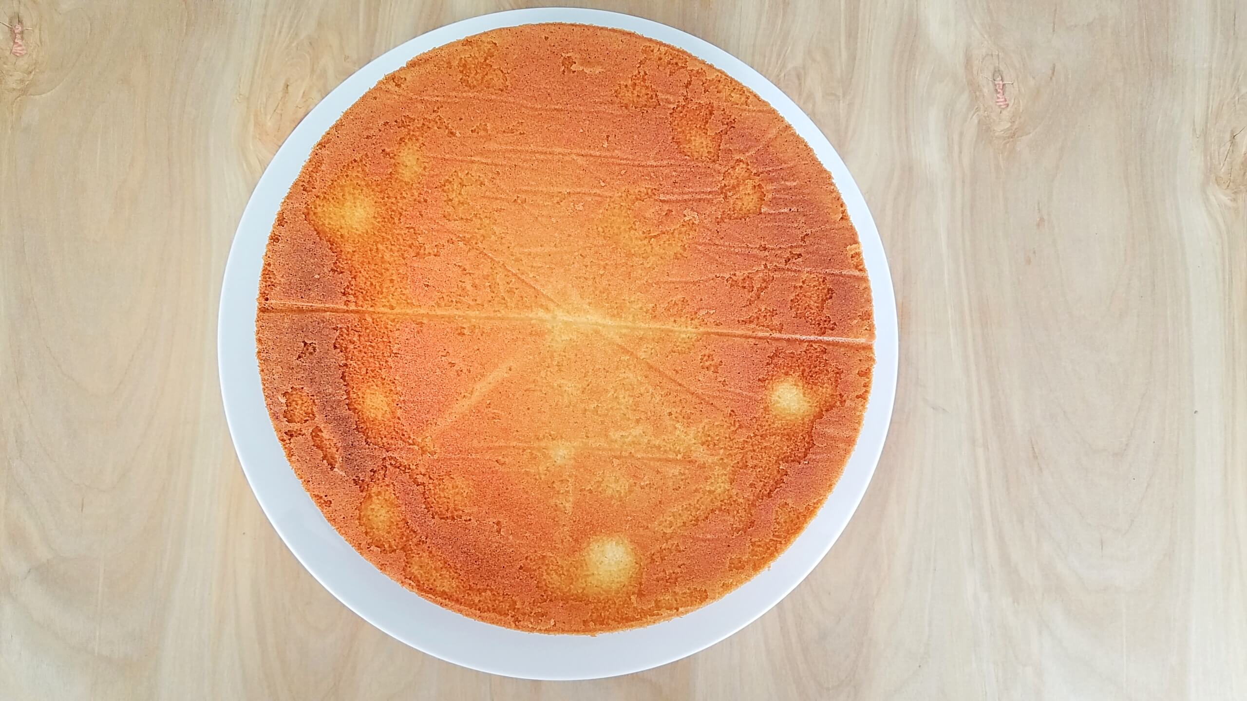 Baked apricot cake cooling completely before adding the topping.