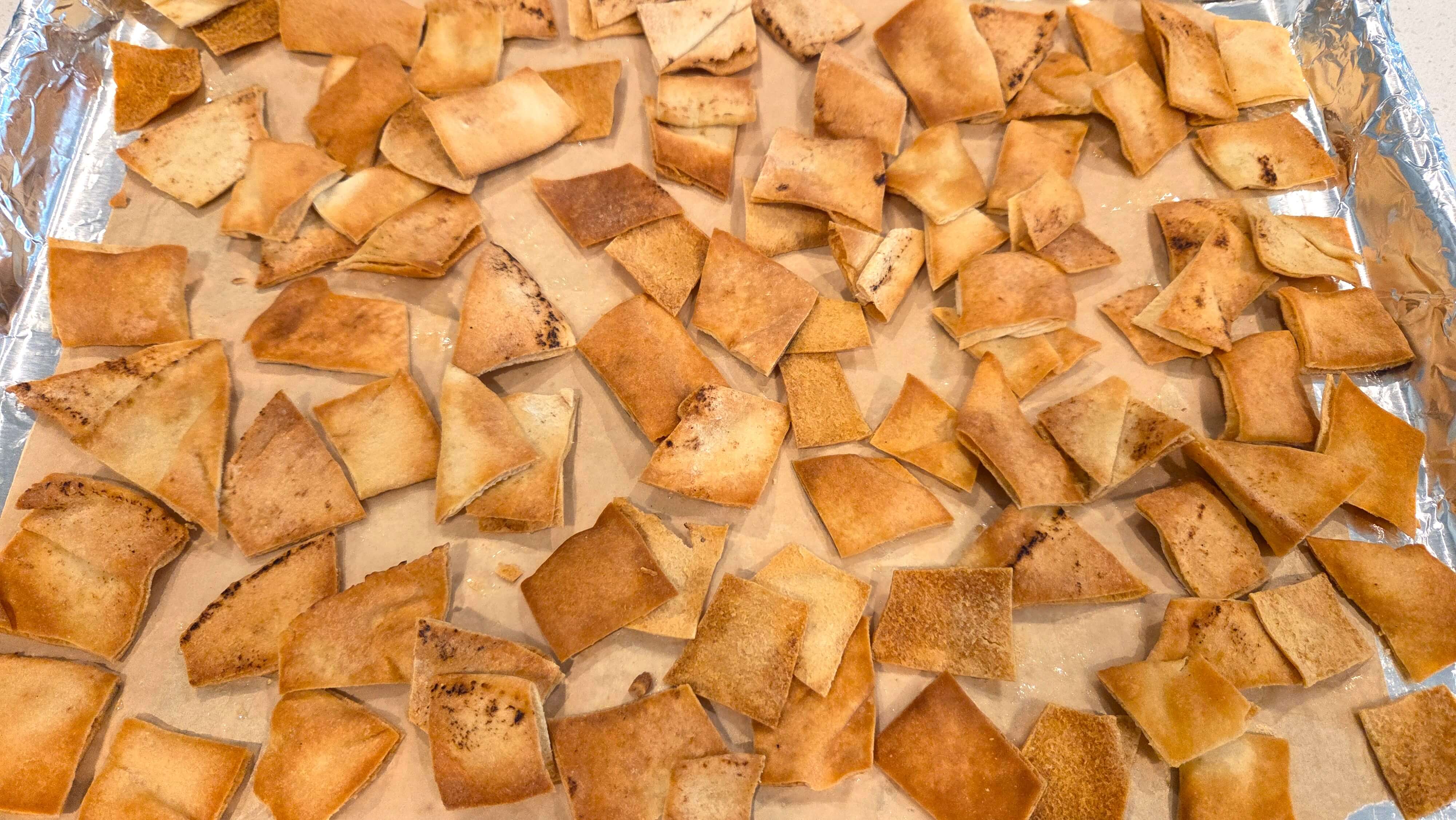 Pita bread pieces tossed with ghee and toasted until golden and crisp.