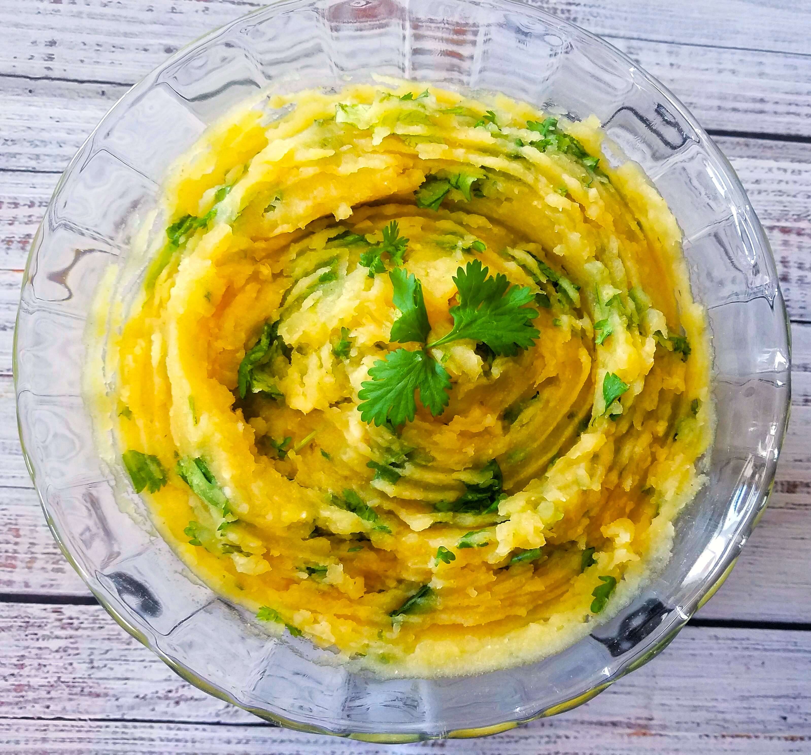 Mashed potato salad mixed with lemon, cilantro, garlic, and olive oil