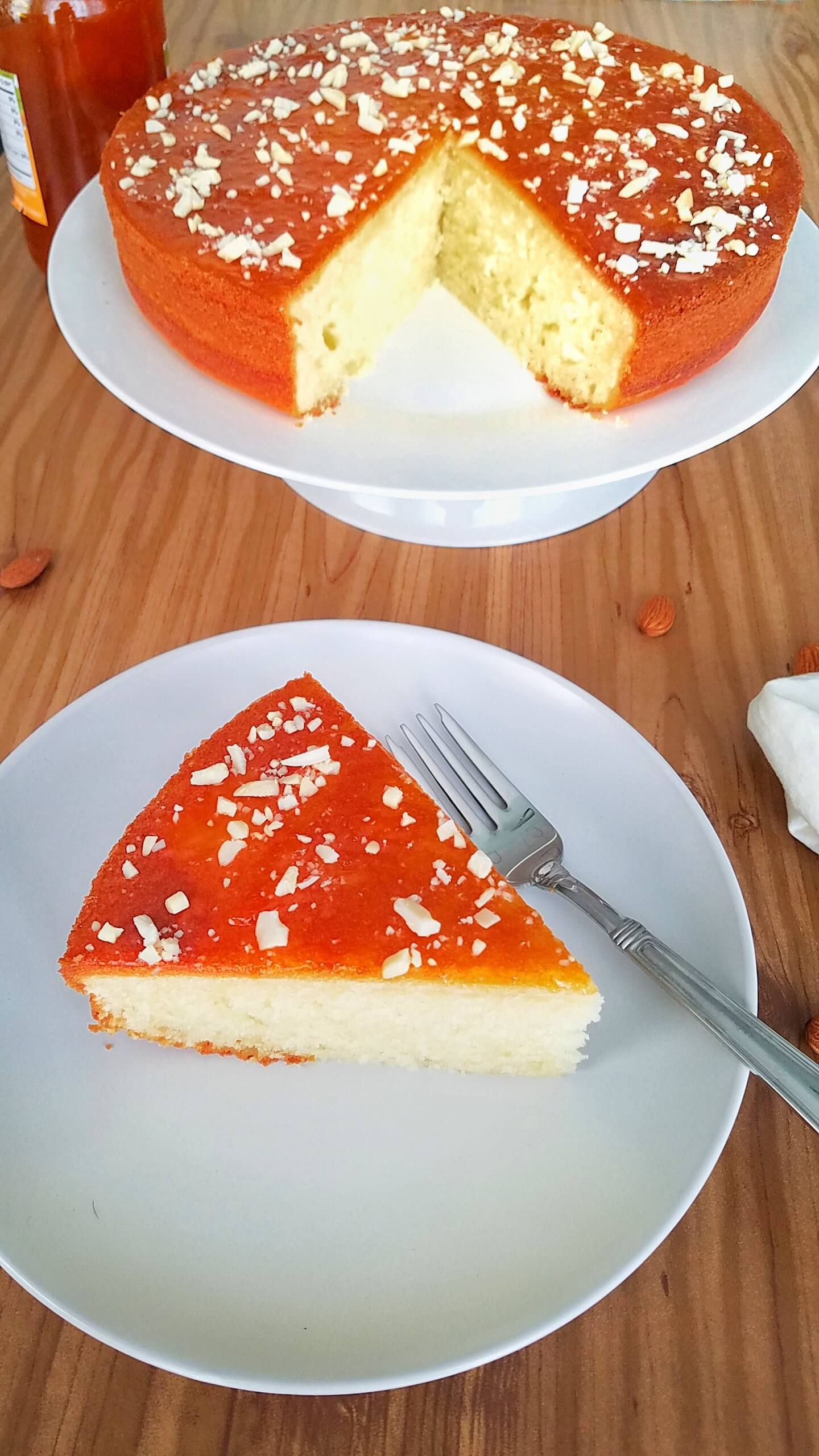 Homemade Moroccan apricot cake with a soft crumb, apricot jam, and chopped almonds.
