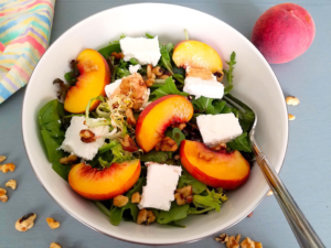 Peach feta salad with juicy peaches, feta cheese, walnuts, arugula, and fresh mint