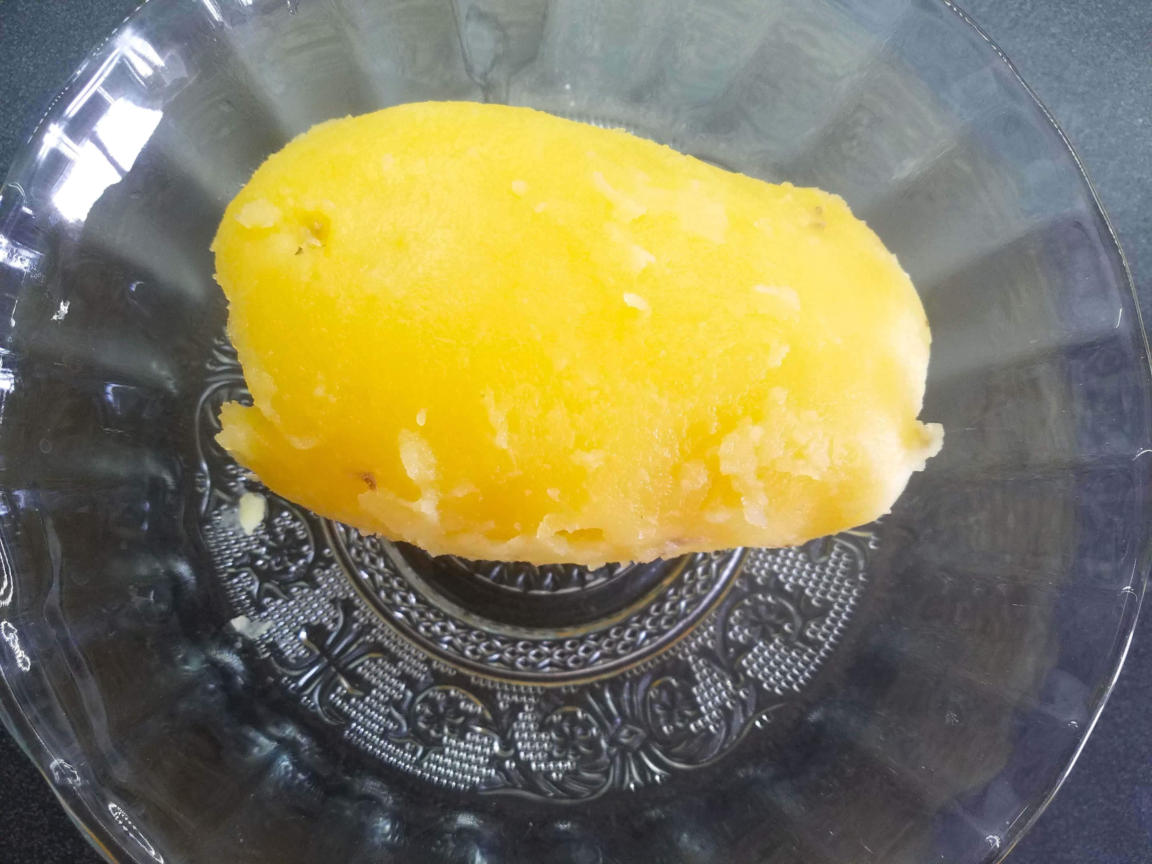 Warm boiled potato peeled for mashed potato salad