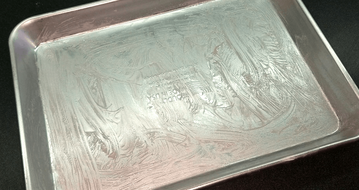 Baking sheet brushed with melted butter.