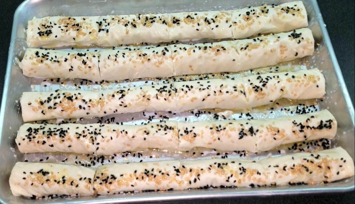 Phyllo rolls cut into smaller pieces and topped with sesame and nigella seeds