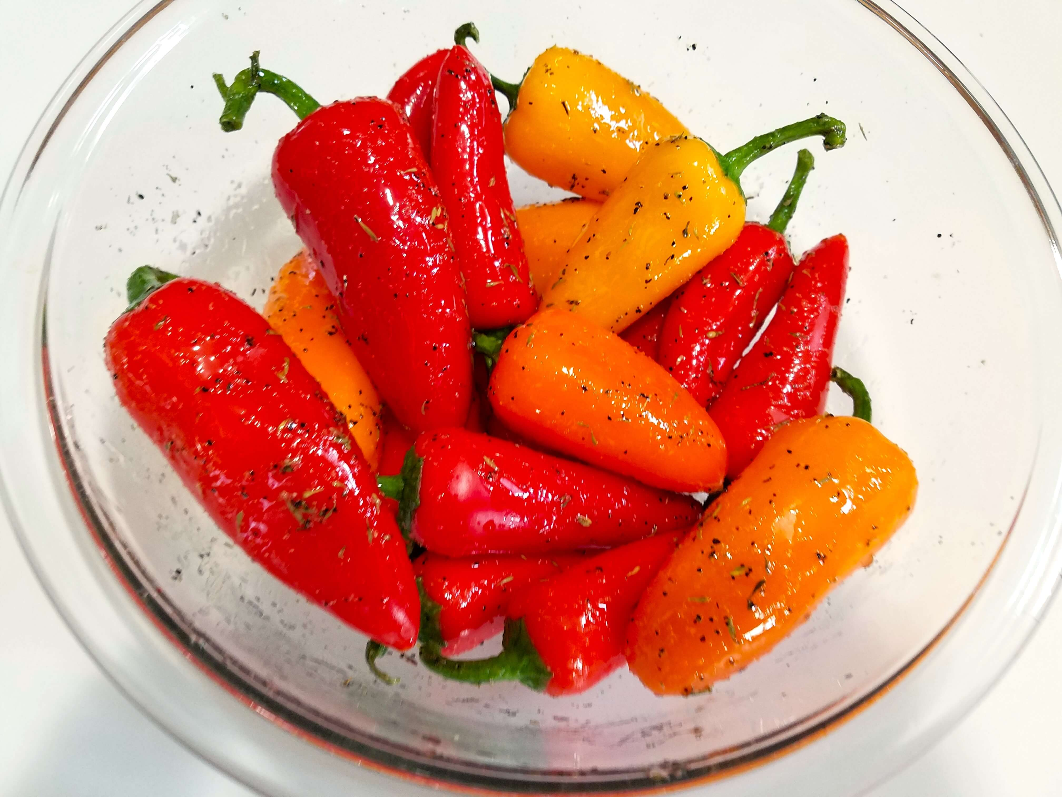 sweet peppers tossed with olive oil, dried thyme, rosemary, salt, and black pepper
