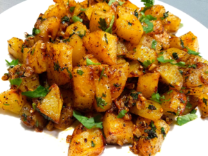 Batata Harra Lebanese spicy potatoes with crispy golden edges, garlic, cilantro, and lemon