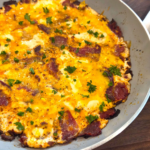 Beid Bel Basturma Egyptian scrambled eggs with sliced basturma served in a skillet
