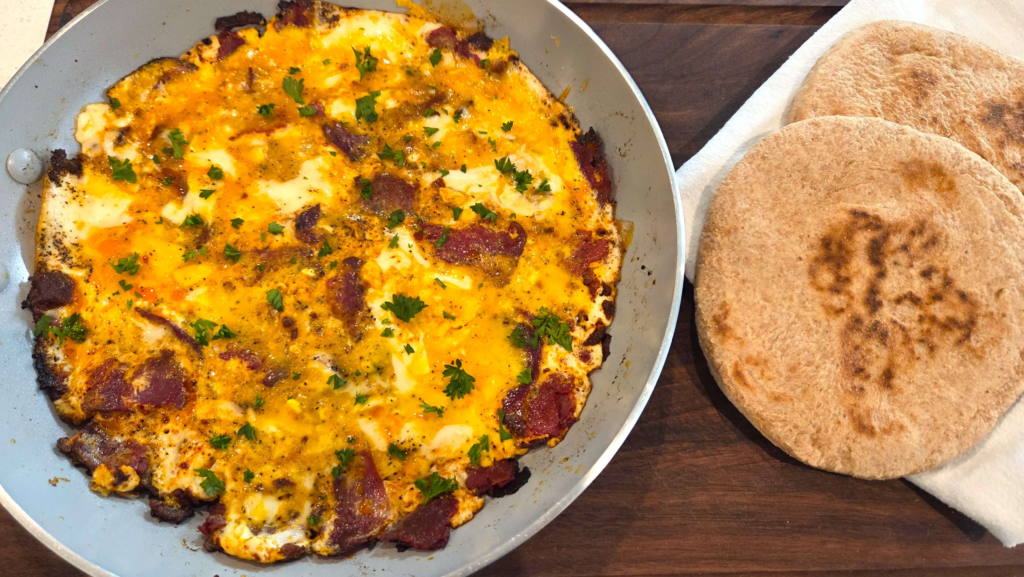 Beid Bel Basturma scrambled eggs served with warm baladi bread