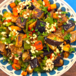 Egyptian eggplant salad with golden fried eggplant, colorful bell peppers, fresh parsley, and tangy garlic dressing.