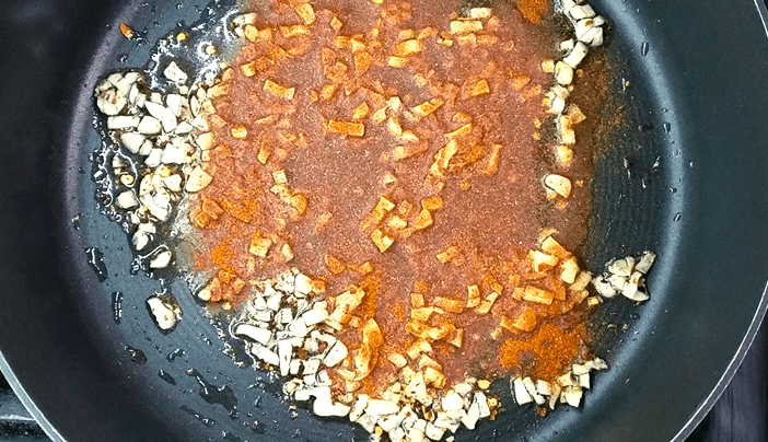 Minced garlic, red pepper flakes, and paprika sautéed in warm olive oil