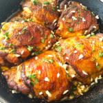 Lemon garlic chicken thighs with crispy golden skin and fresh parsley