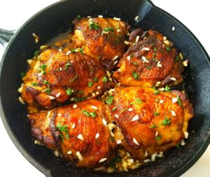 Lemon garlic chicken thighs with crispy golden skin and fresh parsley