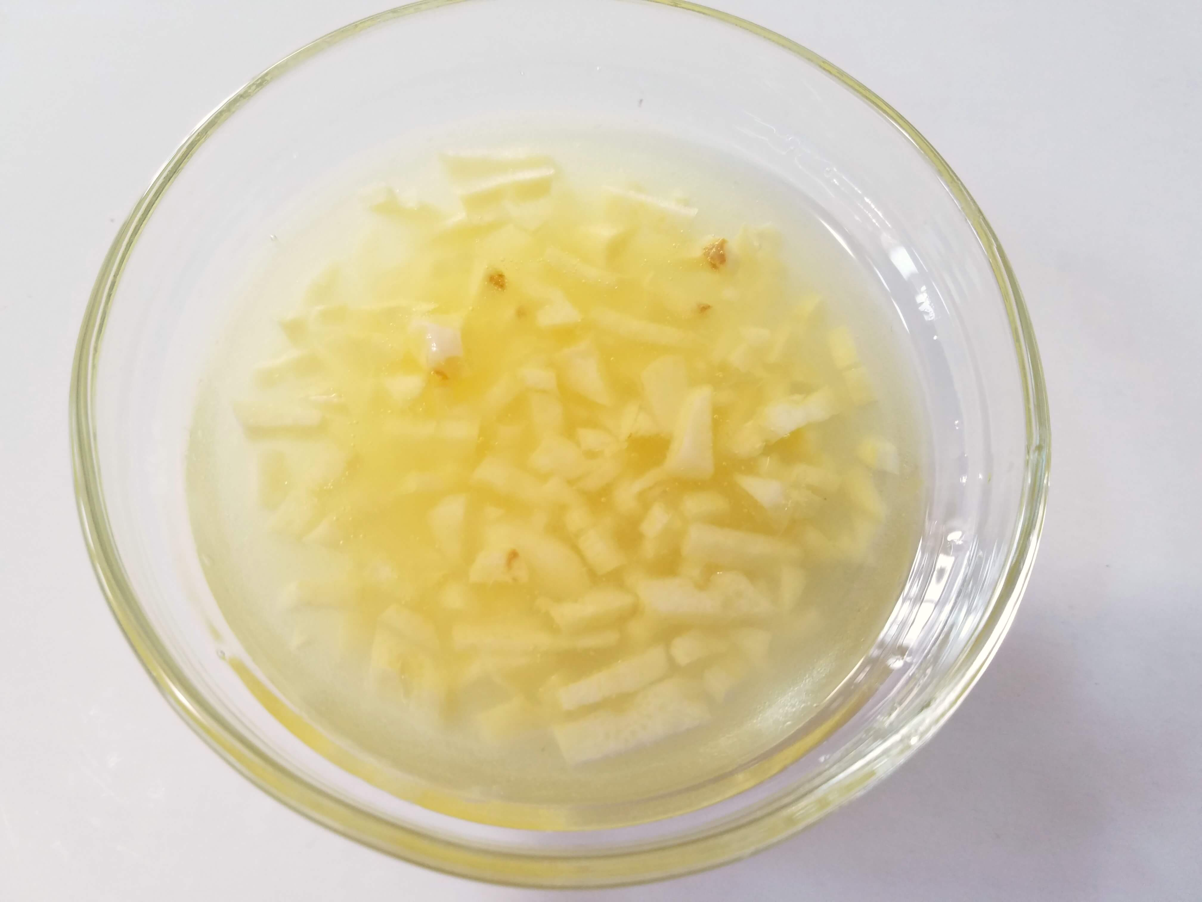 Fresh lemon juice and minced garlic mixed in a bowl