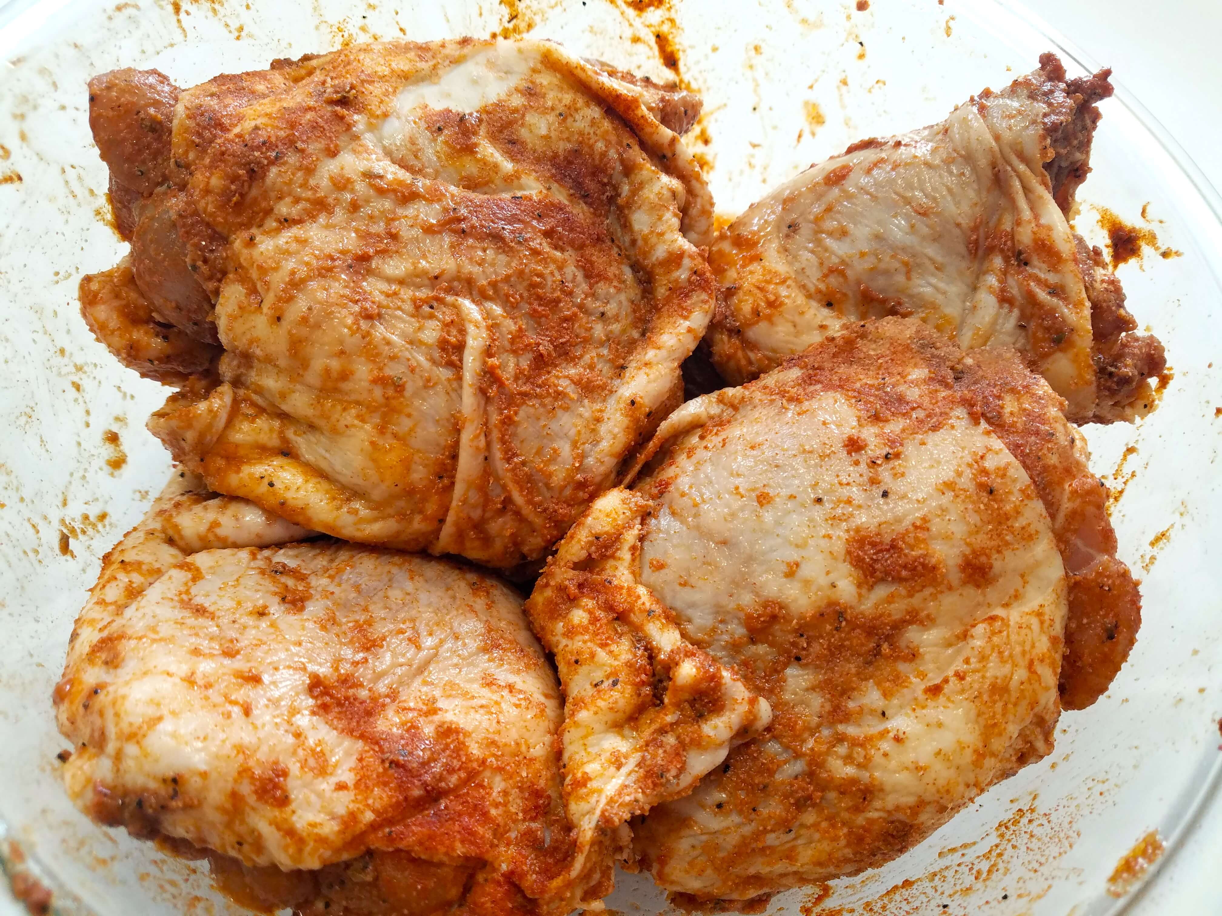 Bone-in chicken thighs coated in lemon, garlic, and Mediterranean spices before cooking